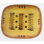 Coldstone Pottery slipware dish, of shaped rectangular form, decorated in brown slip with combed and