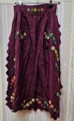 A Victorian moire silk embroidered apron, the embroidery appliqued flowers in varying colours,