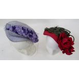 Various vintage hats to include a pink straw hat embellished with faux silk roses and leaves,