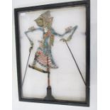 Four Javanese puppets each painted and decorated on turned wooden stick and stand within perspex and