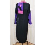 A black wool crepe dress with pink leather, black velvet and black leather detail labelled "Anne
