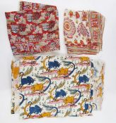 Collection of ethnic fabrics and bags including kilim bags, two silk scarves, a length of cotton