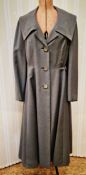A 1940's grey coat labelled 'Elmoor of London W', box pleat at the back of the full skirt, three