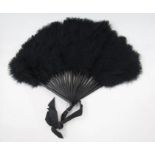 Ostrich feather fan with black painted wooden sticks (three are repaired), a Chinese/Japanese