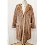 A 1960/70's brown mink coat, three quarter length half belt, button detail to the cuffs, side