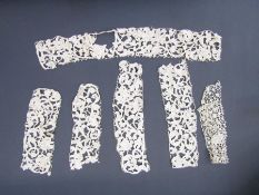 Five pieces of needlepoint lace, possible Venetian grospoint, with padded cordonnet, 2 x 33cm