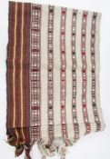 Collection of runners and wall hangings including two Bhutan runners woven with bold geometric