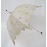Five various vintage parasols, one with a folding wooden handle, turquoise silk lining and