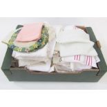 Two pairs of linen sheets, quantity of table linen to include table cloths, hand towels, mats,