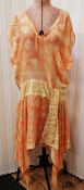 A 1920's apricot cream and yellow chiffon drop waisted dress, handkerchief hem with a small panel,