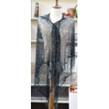 1920's shawl, black net embroidered with midnight blue beads, a beaded fringe