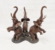 Bronze centrepiece formed as three rearing elephants, with curled trunks, on trefoil base,