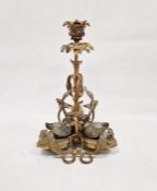Late 19th century gilt metal candlestick surmounted with three swans before a frond sconce nozzle