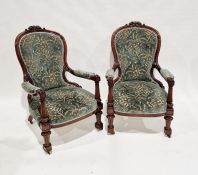 Pair of Victorian mahogany armchairs with pierced and carved acanthus leaf finials, button backs,