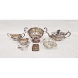 Silver-plated tea service comprising teapot, sugar bowl and cream jug, with repousse decoration