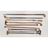 Collection of Victorian and later walking sticks including silver mounted examples, examples with