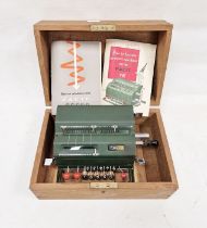 Cased vintage Facit (Sweden) mechanical calculator with instruction manual and original wooden