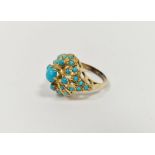 Gold and turquoise cluster ring bearing crown mark, gross weight 5.5g approx.