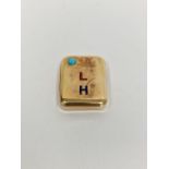 Gold-coloured metal, turquoise and enamel vesta case, rounded rectangular, set with single turquoise