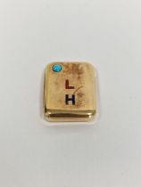 Gold-coloured metal, turquoise and enamel vesta case, rounded rectangular, set with single turquoise