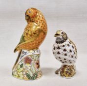 Two Royal Crown Derby bone china bird paperweights, comprising: a 'Sun Parakeet', printed and