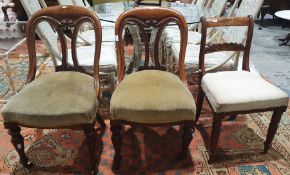 Pair of 19th century oak chairs with rounded seat back and carved central splat, upholstered