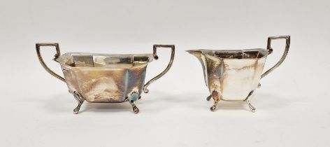 George VI silver twin handled sugar bowl and matching milk jug, of octagonal form raised on paw