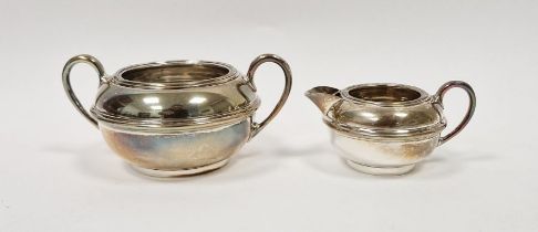 George V silver twin handled sugar dish and a matching silver cream jug, hallmarked Chester 1913