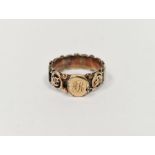 Victorian gold-coloured metal and enamel mourning ring having oval medallions with italic letters