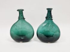 Two Persian green glass saddle flasks, 18th/early 19th century, each of compressed form with trailed
