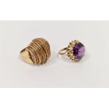 Two gold-coloured rings, one inset faceted blue-purple stone and the other of filigree hooped