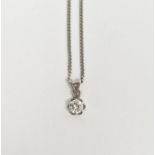18ct gold solitaire diamond pendant on fine 18ct white gold curb-link chain, the claw-set stone 0.