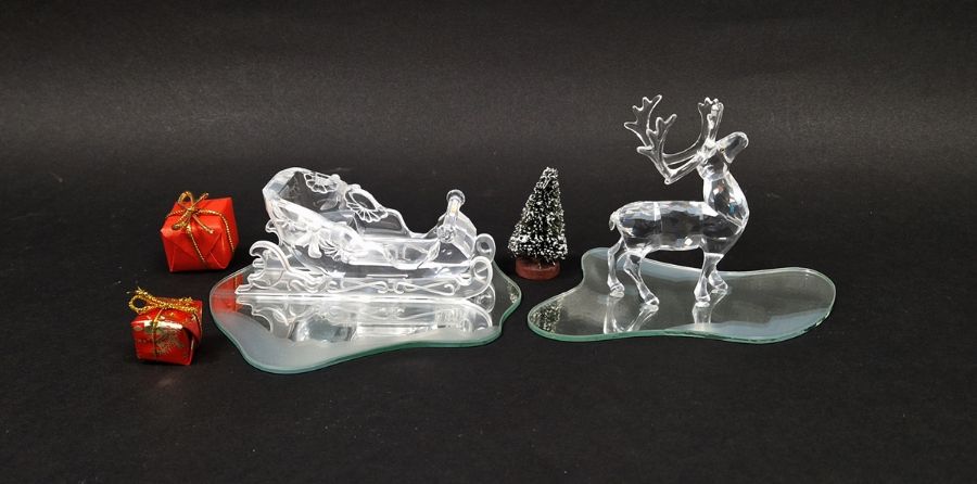 Two Swarovski crystal models from the Exquisite Accents series, comprising Sleigh 1996 (205165) with