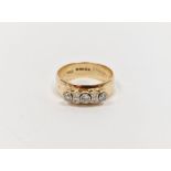 9ct gold and diamond ring having yellow band set with three collet-set diamonds interspersed with