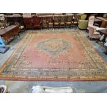 Large antique Heriz handmade wool pile carpet pink ground, with central hexagonal geometric