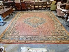 Large antique Heriz handmade wool pile carpet pink ground, with central hexagonal geometric