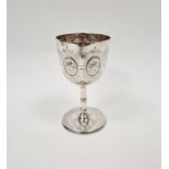 Victorian silver goblet, decorated with embossed and engraved foliate motifs, with slender stem on