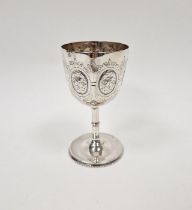 Victorian silver goblet, decorated with embossed and engraved foliate motifs, with slender stem on