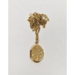 9ct gold oval locket, bird and floral engraved and a 9ct gold flattened curb-link chain, 5.2g
