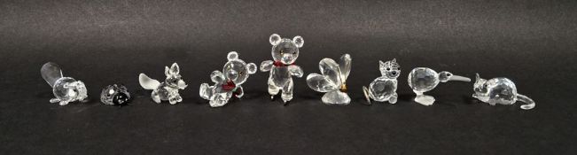 Nine Swarovski crystal animal models to include a bear on ice skates, a reclining bear, a
