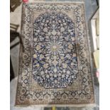 Persian blue ground handmade wool, cotton and silk 'Nain' rug with central floral medallion on