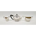 Late Victorian three piece silver tea set, with half gadrooned decoration, comprising tea pot, two