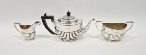 Late Victorian three piece silver tea set, with half gadrooned decoration, comprising tea pot, two