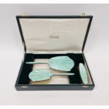 Cased set of silver mounted guilloche enamel dressing table set, comprising two brushes and a