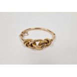 Edwardian gold-coloured metal knot-pattern bangle with engraved decoration, dated 31/08/05, 14g