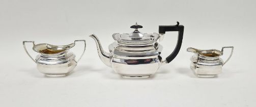 Edwardian three piece silver tea set, comprising tea pot, twin handled sugar bowl and a milk jug,