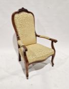 Late 19th/early 20th century mahogany armchair with carved floral finial, with upholstered seat