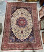 Pair of Persian handmade cream ground wool, cotton and silk 'Ispahan' rugs with large central