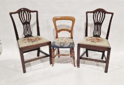 Pair of Hepplewhite style mahogany dining chairs with pierced vase splats, the drop in seats with