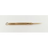 9ct gold propelling toothpick with engine-turned decoration